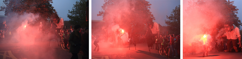 Macnas parade galway 2014 Troll past Salmon Weir bridge in red smoke